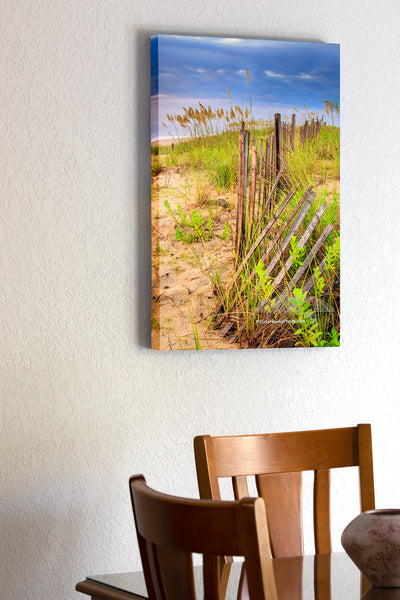 20"x30" x1.5" stretched canvas print hanging in the dining room of Summer storm on the coast of NC at Kitty Hawk. The sand fence and sea oats make for a dramatic foreground with the summer beach storm in the background.