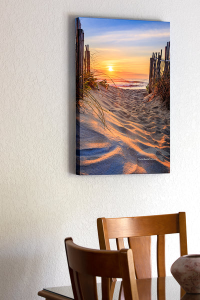 20"x30" x1.5" stretched canvas print hanging in the dining room of Kitty Hawk beach access at sunrise on the Outer Banks, NC. It's interesting how the sunlight plays across the foot prints in the sand.