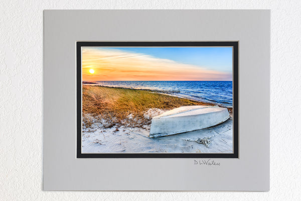 5 x 7 luster prints in a 8 x 10 ivory and black double mat of  Overturned boat at sunset on Cape Hatteras Island.