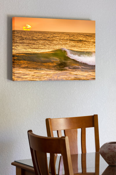 20"x30" x1.5" stretched canvas print hanging in the dining room of Picture of a golden sunrise at a Outer Banks beach.