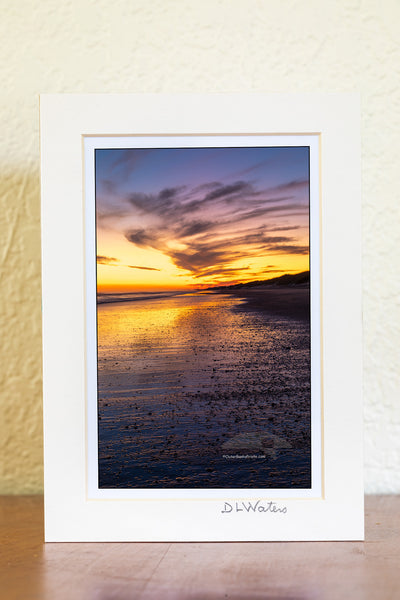 Just after sunset along Frico beach in Cape Hatteras National Seashore. Because the way Cape Point stretches out into the Atlantic ocean Frisco beach is one of the few places on the Outer Banks the sun rises and sets along the beach.