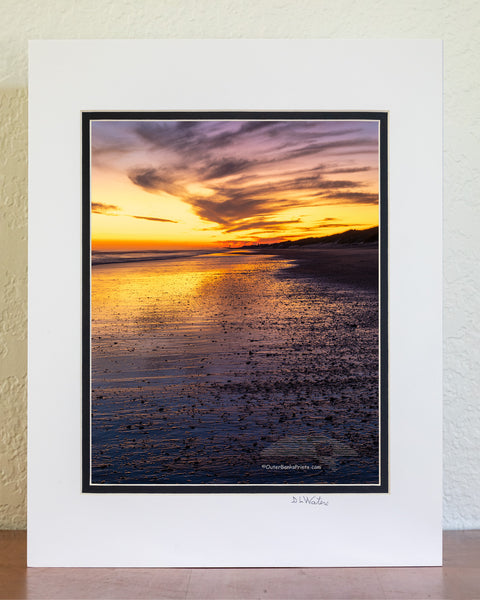 Just after sunset along Frico beach in Cape Hatteras National Seashore. Because the way Cape Point stretches out into the Atlantic ocean Frisco beach is one of the few places on the Outer Banks the sun rises and sets along the beach.