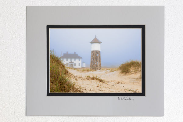 5 x 7 luster prints in a 8 x 10 ivory and black double mat of  A foggy morning at Washed Woods US Coast Guard station number 166, in Carova Beach on the Outer Banks of North Carolina.