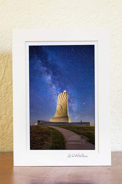 The only way I was able to capture this star filled Milky Way galaxy sky at the Wright Brothers National Memorial in Kill Devil Hills on the Outer Banks of North Carolina was to take two photographs and combine them in Photoshop. The light shining on the memorial is way too bright to capture the memorial and the stars in one exposure.