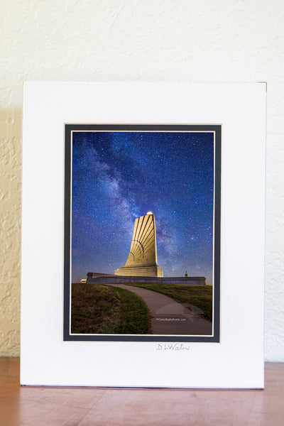 The only way I was able to capture this star filled Milky Way galaxy sky at the Wright Brothers National Memorial in Kill Devil Hills on the Outer Banks of North Carolina was to take two photographs and combine them in Photoshop. The light shining on the memorial is way too bright to capture the memorial and the stars in one exposure.