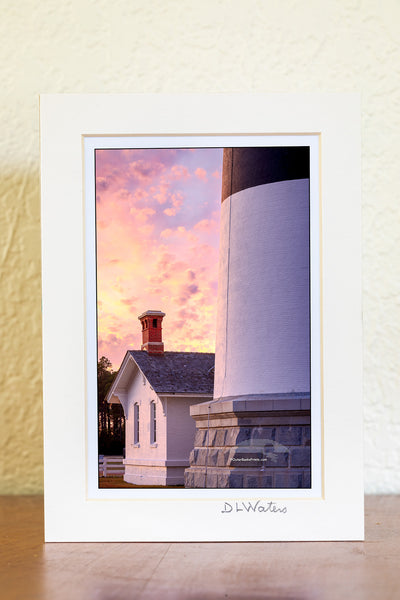 The keeper's quarters at the base of Bodie Island Lighthouse is dwarf next to the size of the lighthouse, on this beautifully cloudy sunset. This little house originally served as the residence for the light keeper at and their family, who were responsible for maintaining the lighthouse and it's light before automation.