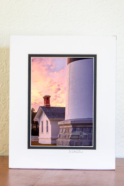 The keeper's quarters at the base of Bodie Island Lighthouse is dwarf next to the size of the lighthouse, on this beautifully cloudy sunset. This little house originally served as the residence for the light keeper at and their family, who were responsible for maintaining the lighthouse and it's light before automation.