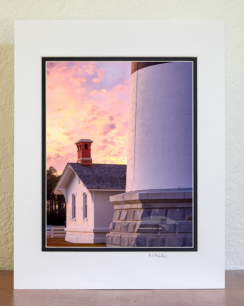 The keeper's quarters at the base of Bodie Island Lighthouse is dwarf next to the size of the lighthouse, on this beautifully cloudy sunset. This little house originally served as the residence for the light keeper at and their family, who were responsible for maintaining the lighthouse and it's light before automation.