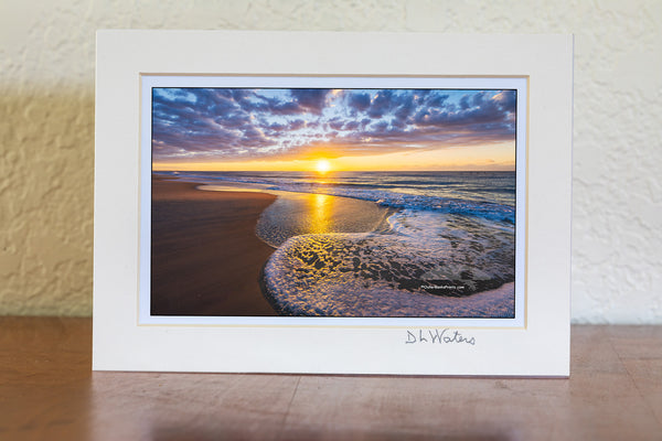 While camping on Cape Hatteras National Seashore at Frisco Campground we got up to see this magical sunrise over the ocean.