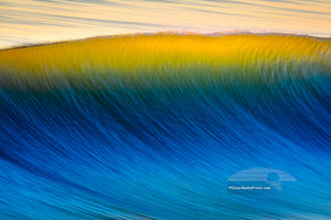 Blue wave with a golden crest taken from Nags Head Fishing Pier on the Outer Banks of North Carolina..