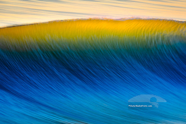 Blue wave with a golden crest taken from Nags Head Fishing Pier on the Outer Banks of North Carolina..