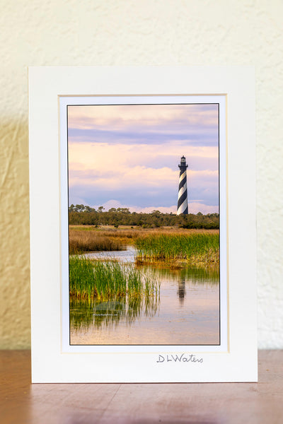 Cape Hatteras Lighthouse reflected in marshy wetlands at Cape Hatteras National Seashore on the Outer Banks of North Carolina.