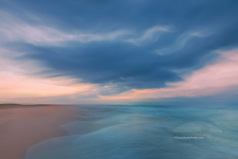 I captured this image by accident. I was standing at the waters edge with my tripod photographing when a large wave washed ashore, I had to grab the camera and run for it. This is how it turned out. This photo was taken at Frisco Beach on Cape Hatteras National Seashore.