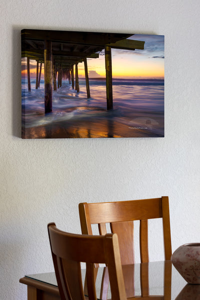 Long exposure under the Nags Head Fishing Pier just before sunrise. Nags Head Pier is one of the oldest and longest piers on the Outer Banks.It is one of the few Outer Banks piers to have a restrant.