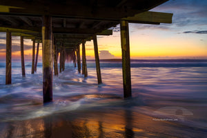 Long exposure under the Nags Head Fishing Pier just before sunrise. Nags Head Pier is one of the oldest and longest piers on the Outer Banks.It is one of the few Outer Banks piers to have a restrant.