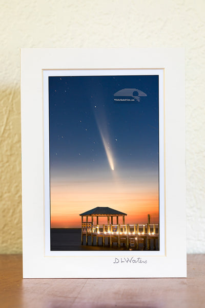 The comet known as C/2023 A3 Tsuchinshan-ATLAS, shines over Kitty Hawk Bay at twilight, captured from Kill Devil Hills beach boat ramp. The gazebo and dock in the foreground add a peaceful touch to this Outer Banks view.