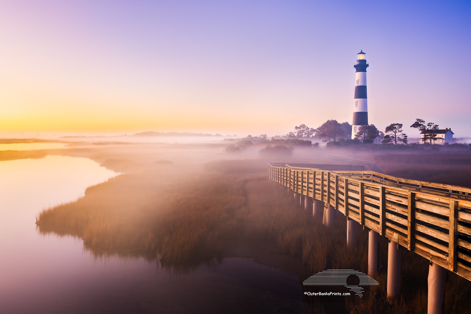 Captured from the observation platform just before sunrise, this photo of Bodie Island Lighthouse shows mist and fog settling over the marsh, adding a quiet sense of mystery.