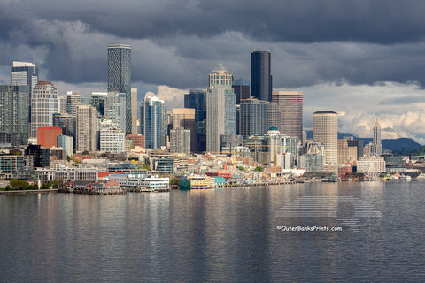 Seattle skyline on a stormy afternoon. The light had just broken through the clouds, making the skyline stand out from the dark clouds.