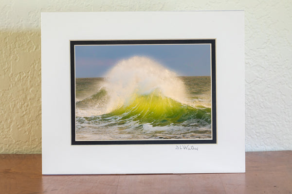 Late afternoon surf collides at Cape Point, revealing the vibrant green hues of the water in Cape Hatteras National Seashore on the Outer Banks of North Carolina.