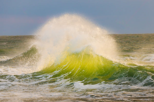 Late afternoon surf collides at Cape Point, revealing the vibrant green hues of the water in Cape Hatteras National Seashore on the Outer Banks of North Carolina.