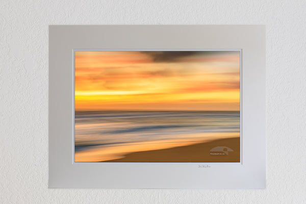 13 x 19 luster print in 18 x 24 ivory ￼￼mat of Soft gold sunrise Beach photo was created by using a long shutter speed and moving the camera a Kill Devil Hills beach on the outer banks of NC.