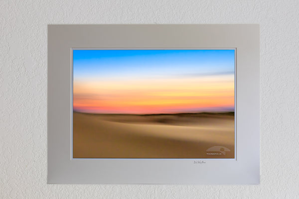 13 x 19 luster print in 18 x 24 ivory ￼￼mat of An impression of Jockey's Ridge State Park at sunset. Moving the camera while the shutter is open creates impressionistic photographs.