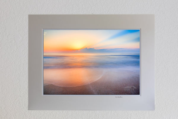 13 x 19 luster print in 18 x 24 ivory ￼￼mat of Sunrise over the beach and ocean on the Outer Banks of NC.