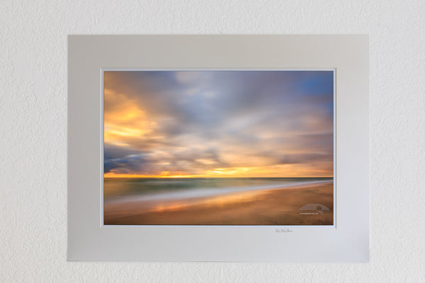 13 x 19 luster print in 18 x 24 ivory ￼￼mat ofA one minute exposure of sunrise on a Kitty Hawk Beach on the Outer Banks, NC.
