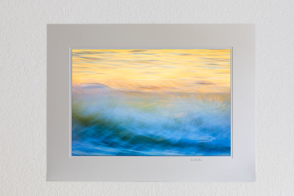 13X19 Luster Print in a 18X24 Ivory mat of  Moving wave impression at sunrise on the Outer Banks of North Carolina.