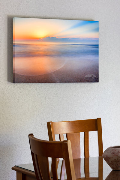 20"x30" x1.5" stretched canvas print hanging in the dining room of Sunrise over the beach and ocean on the Outer Banks of NC.