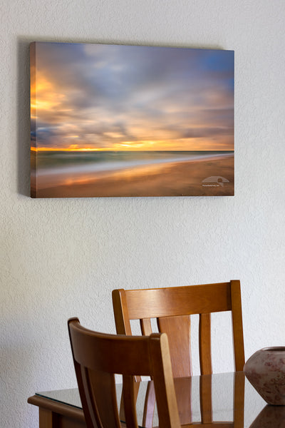 20"x30" x1.5" stretched canvas print hanging in the dining room of A one minute exposure of sunrise on a Kitty Hawk Beach on the Outer Banks, NC.
