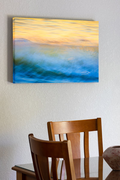 20"x30" x1.5" stretched canvas print hanging in the dining room of Moving wave impression at sunrise on the Outer Banks of North Carolina.