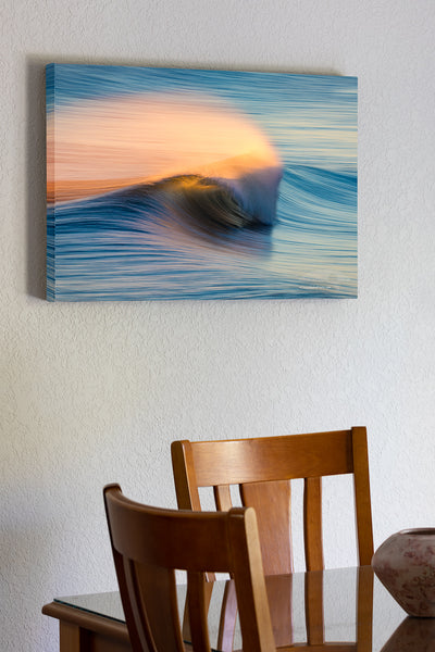 20"x30" x1.5" stretched canvas print hanging in the dining room of Windblown spray from the surf, back lit by the rising sun in Kill Devil Hills on the Outer Banks of North Carolina.