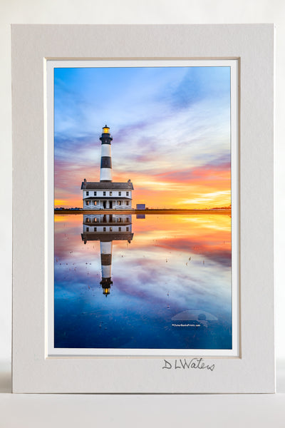 4 x 6 luster print in a 5 x 7 ivory mat of Reflection of sunrise and Bodie Island Lighthouse after a hard rain.