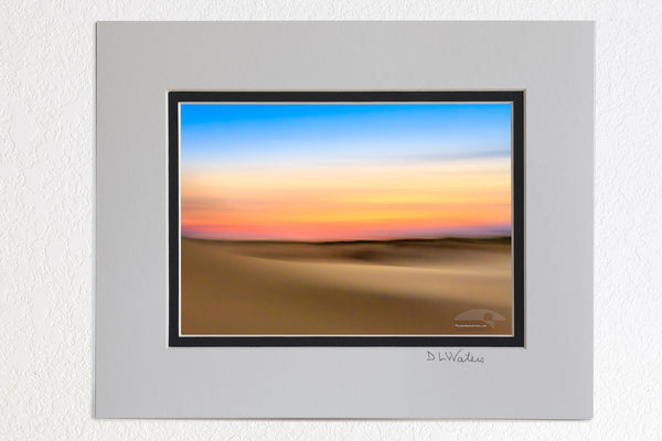 5 x 7 luster prints in a 8 x 10 ivory and black double mat of An impression of Jockey's Ridge State Park at sunset. Moving the camera while the shutter is open creates impressionistic photographs.