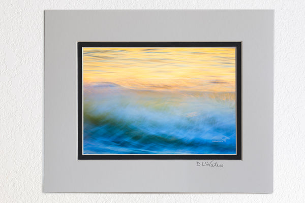  5 x 7 luster prints in a 8 x 10 ivory and black double mat of Moving wave impression at sunrise on the Outer Banks of North Carolina.
