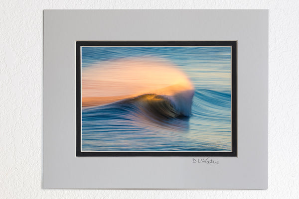 5 x 7 luster prints in a 8 x 10 ivory and black double mat of Windblown spray from the surf, back lit by the rising sun in Kill Devil Hills on the Outer Banks of North Carolina.