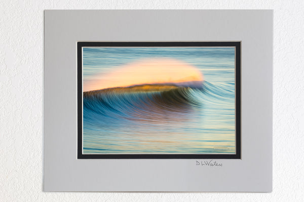 5X7 Luster Print in a 8X10 Ivory and Black Double mat of Sunrise windblown surf spray at Kitty Hawk Pier photographed with a long telephoto lens and a slow shutter speed.