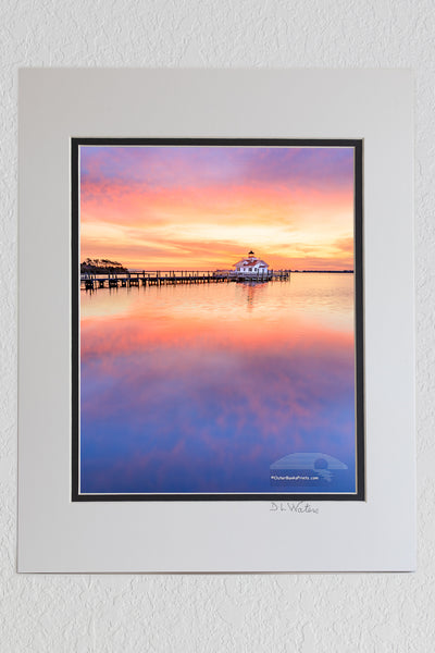 8 x 10 luster print in a 11 x 14 ivory and black double mat of Manteno lighthouse and waterfron sunrise Roanoke Island on the Outer Banks of NC.