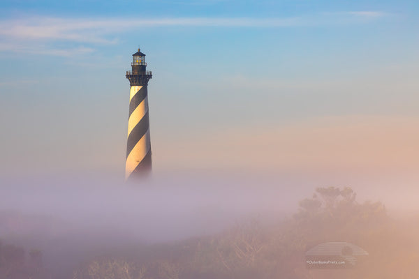 Cape Hatteras Lighthouse in the clear above the fog at Buxton, NC in Cape Hatteras National Seashore.