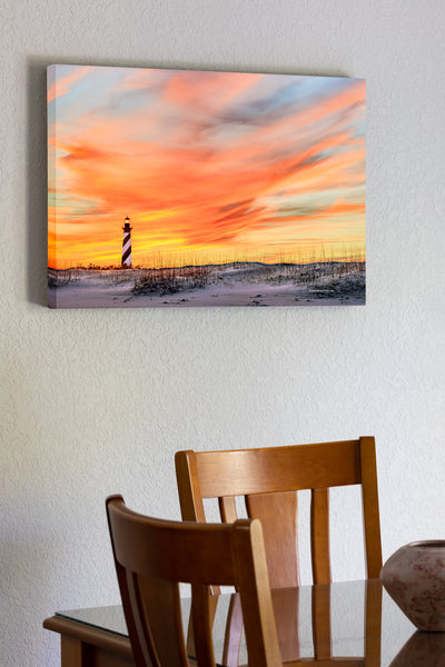 20"x30" x1.5" stretched canvas print hanging in the dining room of Sunset sky at Cape Hatteras Lighthouse on the Outer Banks of NC.