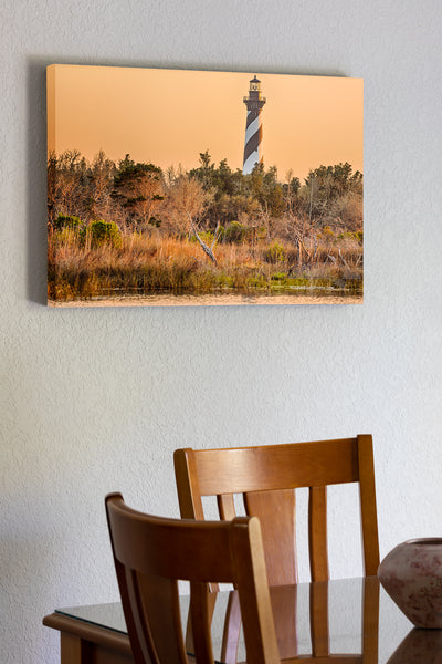 20"x30" x1.5" stretched canvas print hanging in the dining room of Cape Hatteras Lighthouse and reflection on Hatteras Island. This iconic spiral lighthouse is still in use today.