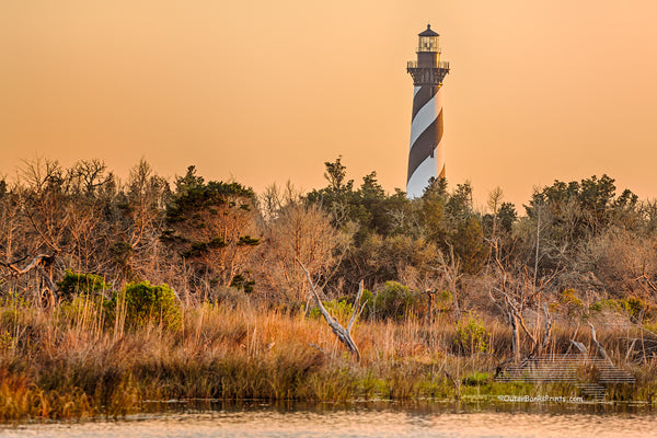 Cape Hatteras Lighthouse and reflection on Hatteras Island. This iconic spiral  lighthouse is still in use today.