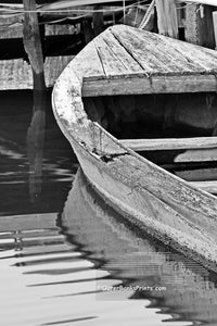 Old boat and dock at hog quarter along Currituck sound.  Photographed in black and white.