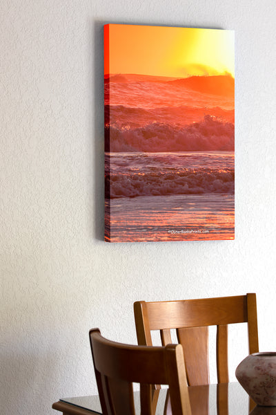 20"x30" x1.5" stretched canvas print hanging in the dining room of Warm orange sunrise surf at a Outer Banks beach.