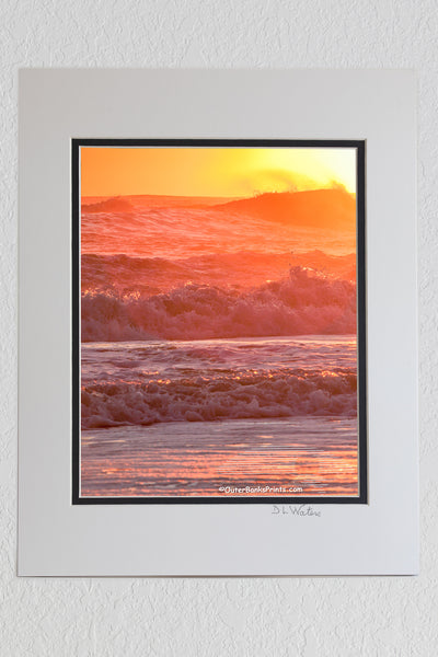 8 x 10 luster print in a 11 x 14 ivory and black double mat of Warm orange sunrise surf at a Outer Banks beach.