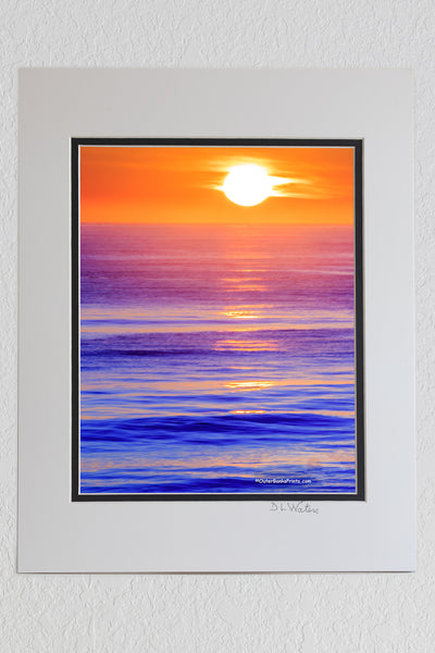 8 x 10 luster print in a 11 x 14 ivory and black double mat of Sunrise over the Atlantic Ocean in Kitty Hawk North Carolina.