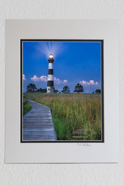 8 x 10 luster print in a 11 x 14 ivory and black double mat of Captured from the boardwalk in the marsh behind Bodie Island Lighthouse just after twilight.