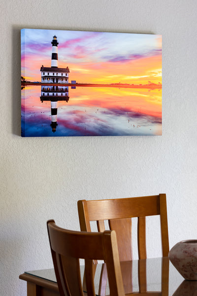 20"x30" x1.5" stretched canvas print hanging in the dining room of  Reflection of sunrise and Bodie Island Lighthouse after a hard rain.