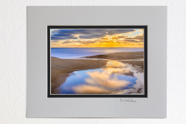 5 x 7 luster prints in a 8 x 10 ivory and black double mat of  A tide pool at Kitty Hawk beach on the Outer Banks of NC reflecting a tranquil sunrise.